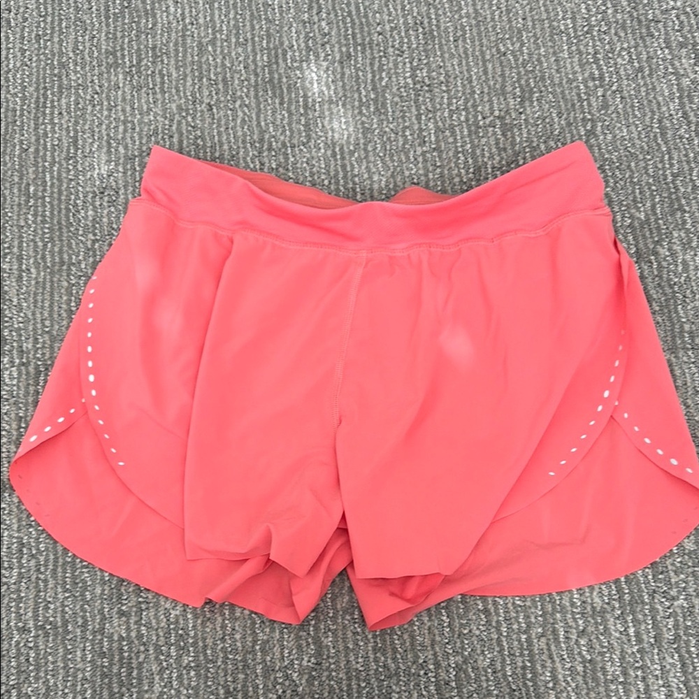 Women's peachy pink Lululemon Fast and free shorts